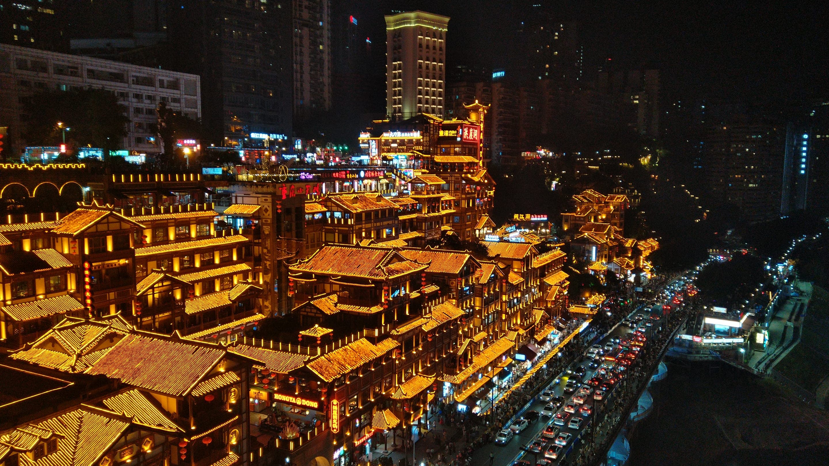 Hongya Cave's lantern-lit stilt houses at blue hour, Chongqing