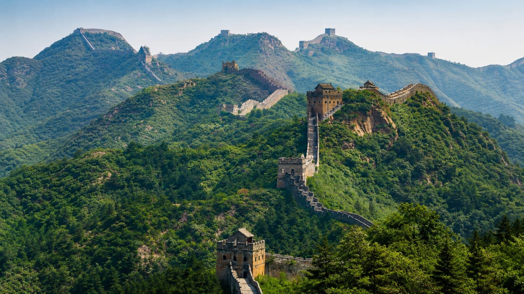 The Great Wall of China at Jinshanling, winding through the mountains at dawn